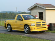Yellow Dodge Ram Truck With Rumble Bee Package
